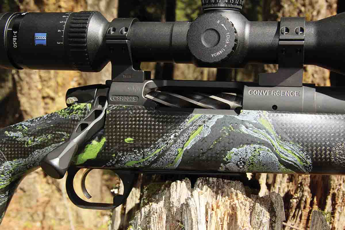 The hinged bottom metal of the AllTerra Mountain Shadow Carbon Rifle is milled from aluminum and released by a tab inside the aluminum trigger guard.